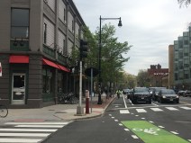 The Massachusetts Avenue protected bike lane near Front Street and the Cambridge Bicycle shop, pictured in May 2019.