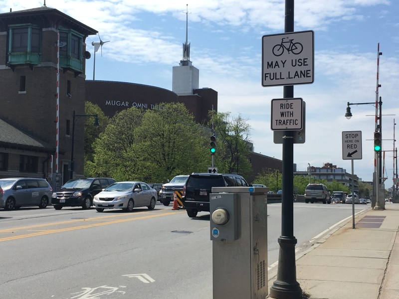 The current state of bike infrastructure on Craigie Bridge (also known as Charles River Dam Road) encourages bikes to take one of the bridge's 6 crowded motor vehicle lanes.