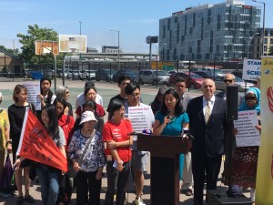 City Councilors Michelle Wu (at podium) and Ed Flynn (behind, to the right) stand with Chinatown social justice advocates at a press conference on the disparate impacts of air pollution from traffic to communities of color on Thursday, June 27, 2019.