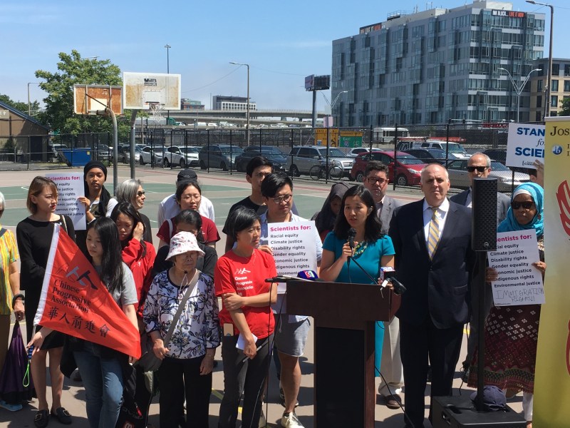City Councilors Michelle Wu (at podium) and Ed Flynn (behind, to the right) stand with Chinatown social justice advocates at a press conference on the disparate impacts of air pollution from traffic to communities of color on Thursday, June 27, 2019.