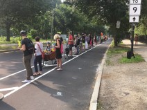 During the morning rush hour on July 11, 2019, dozens of safety advocates gathered to create a "people-protected" barrier for the painted bike lanes on Park Drive in Boston's Fenway neighborhood.