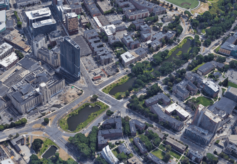 An aerial view of the Back Bay Fens, looking east towards downtown Boston. Brookline Avenue runs diagonally from the upper left to the lower right in this image.