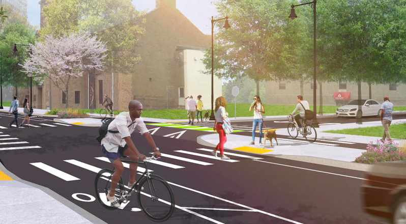 A rendering of the proposed Ruggles Street improvements illustrate new bike lanes, shortened, raised crosswalks, and increased sidewalk space for pedestrians and bus riders. The planned reconstruction project is scheduled to begin in 2020. Courtesy of the City of Boston.