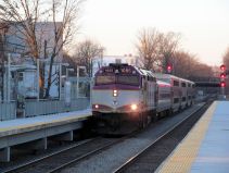 An outbound MBTA Fairmount Line train stops at the Talbot Avenue station in December 2012. Photo by Wikimedia Commons user Pi.1415926535, CC BY-SA 3.0.