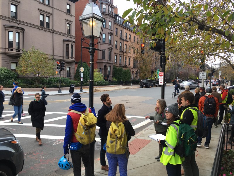 Planners and members of the public discuss the intersection of Beacon and Arlington Streets, a popular but treacherous bike and walking route for people using the Fiedler Footbridge to the Charles River Esplanade, during a community walk on November 7, 2019. This intersection and others around the Common and Public Garden are being considered for upgraded crosswalks and bike routes in the city's Southwest Corridor Extension planning project.