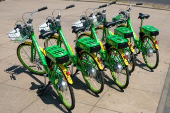 A group of Lime e-bikes parked on a sidewalk. Courtesy of MAPC.