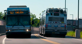 Two Silver Line buses pass each other on the dedicated busway in Chelsea. Photo courtesy of the MBTA.