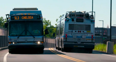 Two Silver Line buses pass each other on the dedicated busway in Chelsea. Photo courtesy of the MBTA.