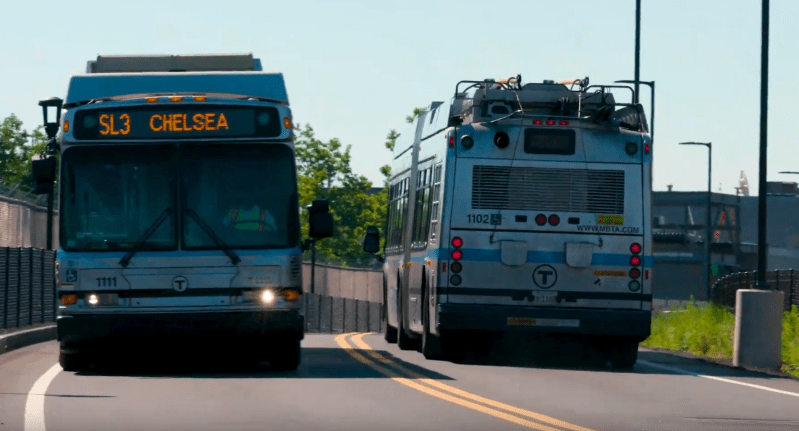 Two Silver Line buses pass each other on the dedicated busway in Chelsea. Photo courtesy of the MBTA.