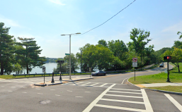 A Google Street View image of Francis Parkman Drive at its intersection with Perkins Street on the north shore of Jamaica Pond in Boston.
