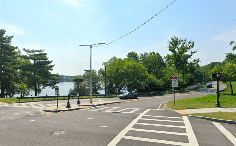 A Google Street View image of Francis Parkman Drive at its intersection with Perkins Street on the north shore of Jamaica Pond in Boston.