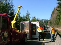 Tow truck drivers are still considered "essential" workers during the COVID-19 pandemic, but with declining traffic, fewer tows, and bigger health risks, drivers in the industry are facing difficult financial decisions. Image courtesy of Washington State DOT, licensed under Creative Commons BY-NC-ND 2.0.
