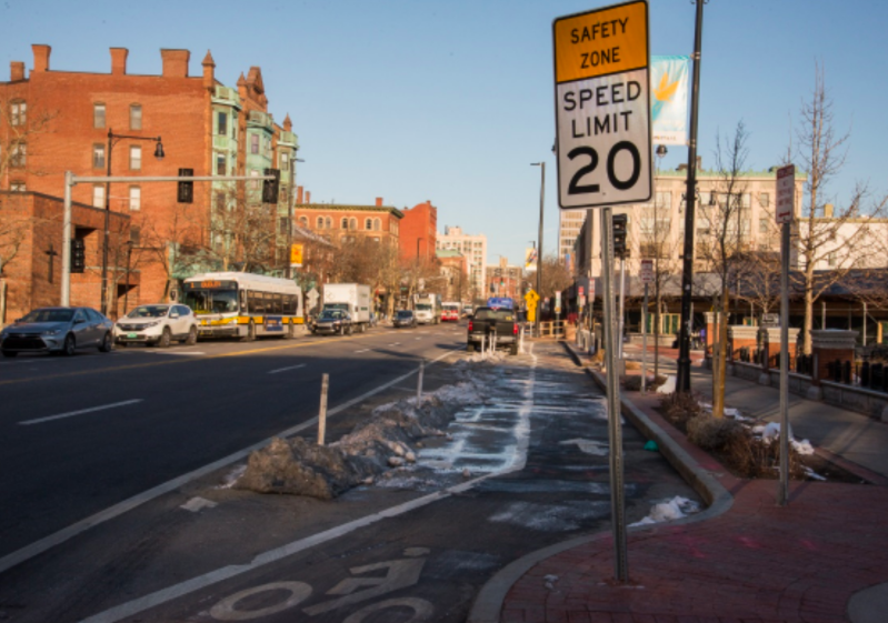 A protected bike lane and 20 mph "safety zone" on Massachusetts Avenue in Cambridge. Courtesy of the City of Cambridge.