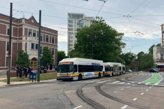 MBTA buses carrying police wait near the Heath Street Green Line stop on the evening of Thursday, June 4, as peaceful protesters gathered nearby. Photo courtesy of Jessica Feldish.