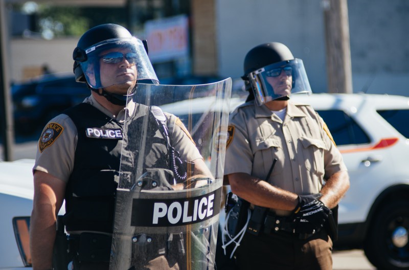 St. Louis County police in riot gear confront protesters n Ferguson in August 2014. Photo by Jamelle Bouie, licensed under Creative Commons.