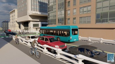 “The Chain” Bike Lane Delineator, designed by team Culture House lead by Aaron Grenier, features a bike lane shielded from car and bus traffic by a large, waist-high lane delineator that resembles a large bicycle chain. The links in the chain form the barrier while the pins of the chain are anchored into the ground.