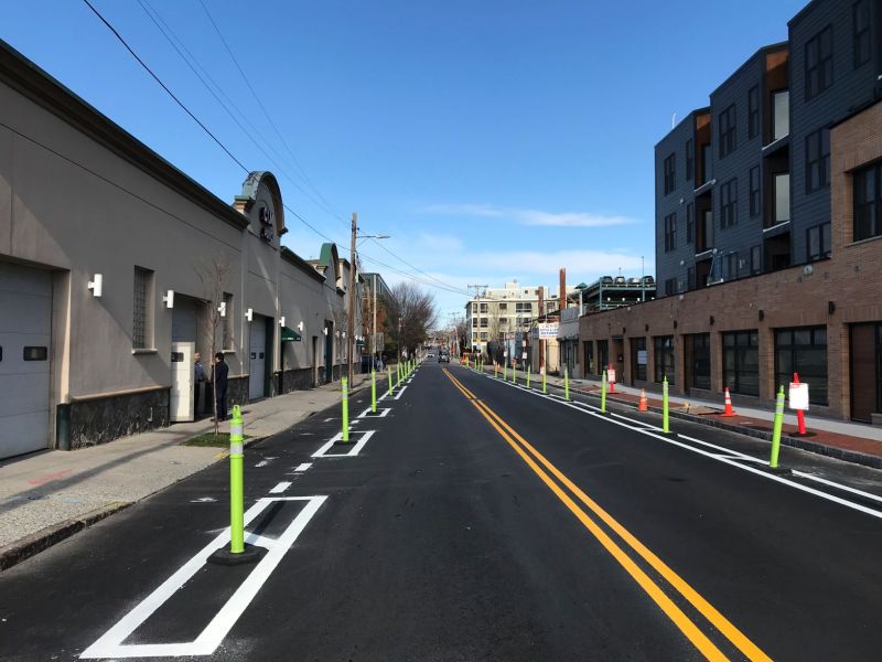 A freshly-paved Webster Avenue in Cambridge with new protected bike lane markings.