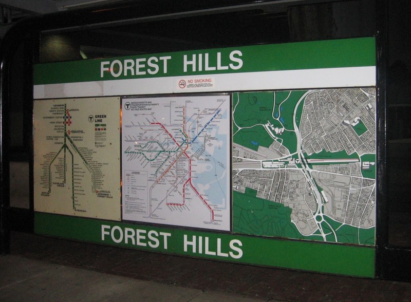 A relic Green Line sign at Forest Hills Station, pictured in 2011. The Green Line's E Branch service to Forest Hills was suspended in the 1980s and never returned. Photo courtesy of Wikimedia Commons user Pi.1415926535.