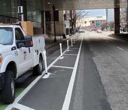 New flexible-post bollards have been installed on the Massachusetts Avenue bike lanes through the Boston Medical Center campus. The posts replace sturdier concrete barriers that were removed in December after motorists crashed into them. Photo courtesy of the City of Boston Transportation Department.