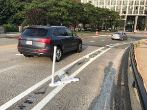 Vandalized flexposts on the Broadway Bridge in South Boston