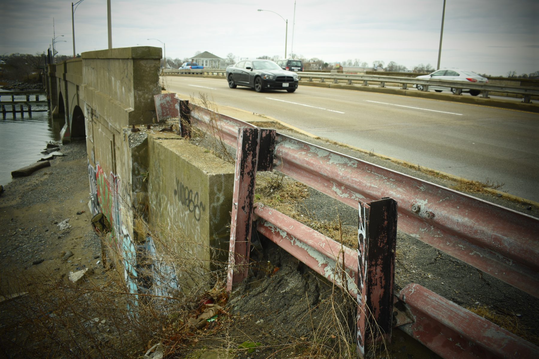Temporary fencing lines the sidewalk on the DCR-controlled approach to the Beades Bridge. Google Street View imagery suggests that the temporary fencing has been there for nearly 8 years. Photo by Tony Dutzik.