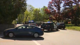 Police cars block West Chestnut St. in Brockton after a driver struck and killed a 50 year-old woman walking on the street Wednesday morning.