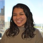 Portrait of Grecia White in front of the downtown Boston skyline