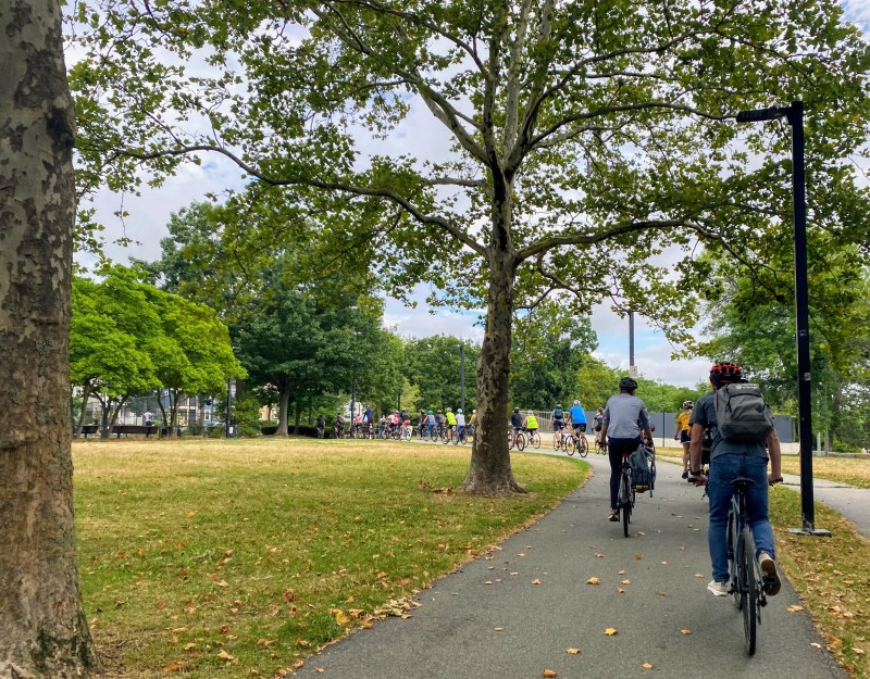 Bicyclists ride on a section of the Southwest Corridor between Green Street and Stony Brook stations during the group bike ride with Mayor Michelle Wu last Thursday morning.